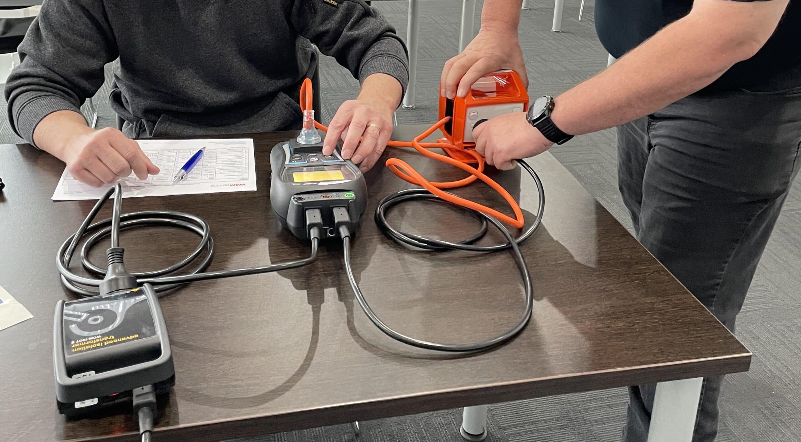 Test and Tag Electrical Equipment Melbourne technician inspecting office devices