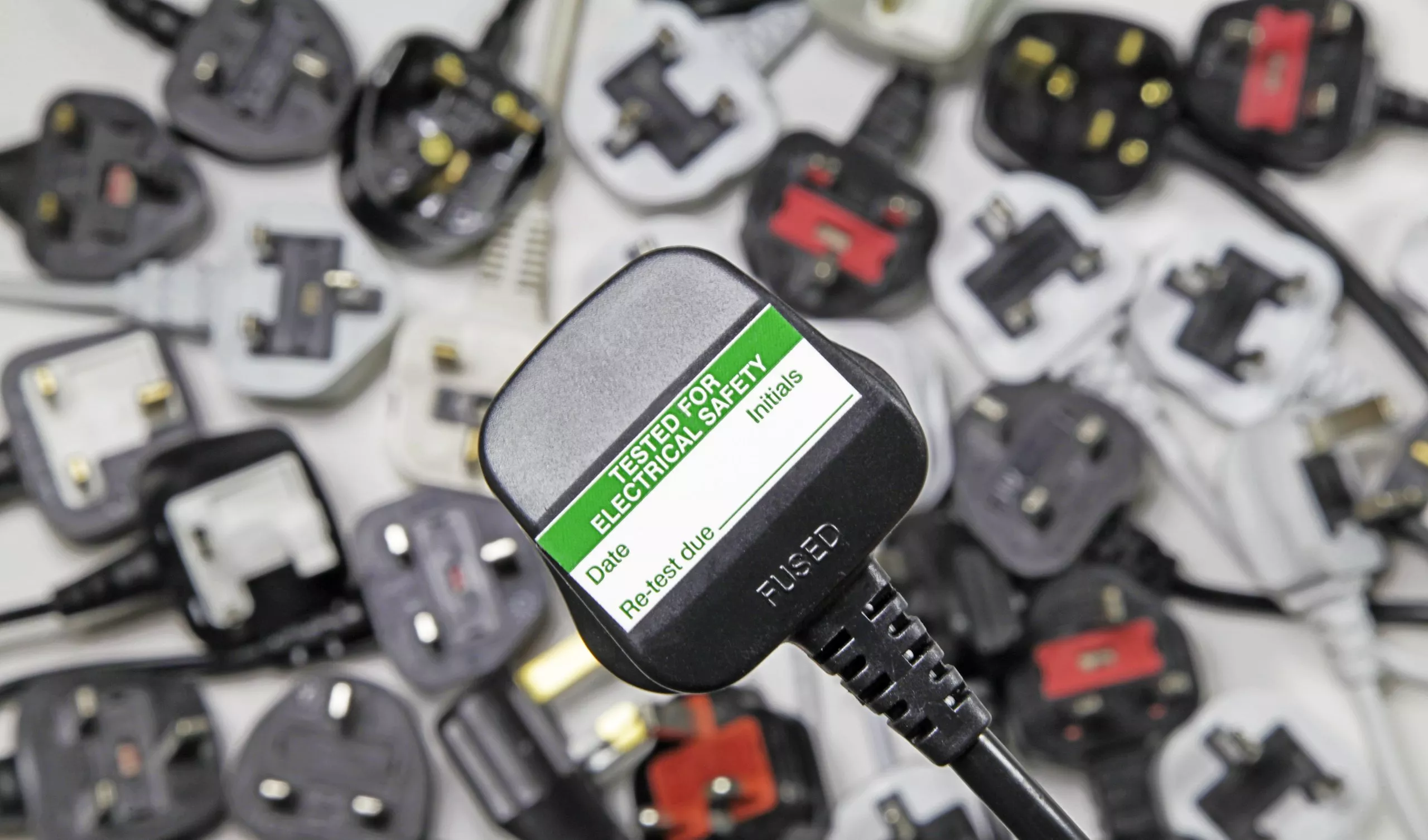 Extension Lead Testing Melbourne technician inspecting power cords and multi-boards